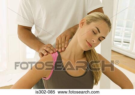 Stock Photography - Woman having her shoulders massaged. Fotosearch