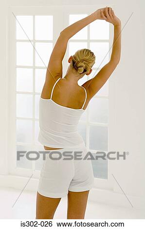 Woman stretching View Large Photo Image Stock Photograph - Woman stretching. Fotosearch