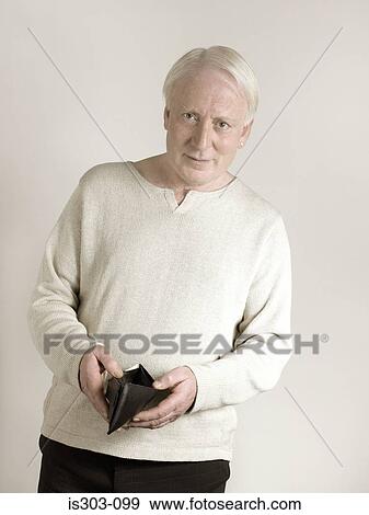 Stock Photo - Man with empty wallet. Fotosearch