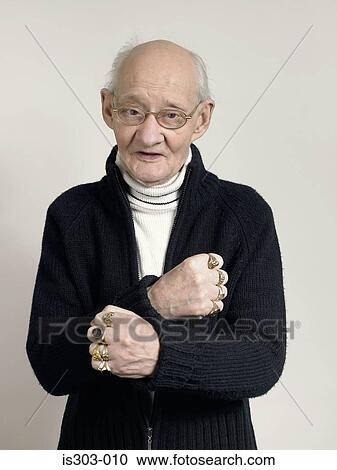 Senior man wearing finger rings View Large Photo Image Stock Image - Senior man wearing finger rings. Fotosearch