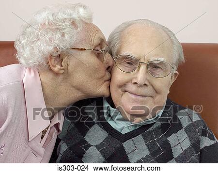 Woman kissing man on the cheek View Large Photo Image Picture - Woman kissing man on the cheek. Fotosearch