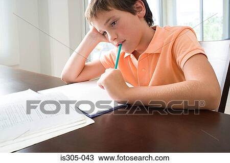 Boy bored with homework View Large Photo Image Stock Image - Boy bored with homework. Fotosearch