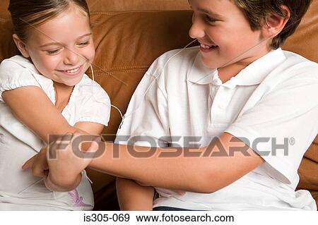 Brother and sister playing View Large Photo Image Stock Photo - Brother and sister playing. Fotosearch