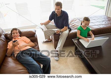 Family doing separate activities View Large Photo Image Stock Photo - Family doing separate activities. Fotosearch