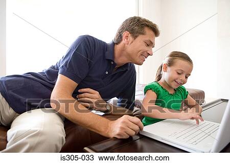 Father and daughter using laptop View Large Photo Image Stock Image - Father and daughter using laptop. Fotosearch