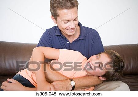 Father and son playing View Large Photo Image Stock Photography - Father and son playing. Fotosearch