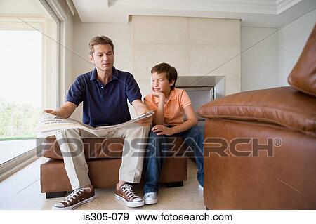 Father and son reading newspaper View Large Photo Image Stock Photo - Father and son reading newspaper. Fotosearch