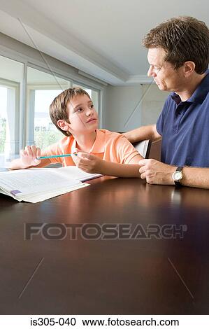 Father helping son with homework View Large Photo Image Stock Image - Father helping son with homework. Fotosearch