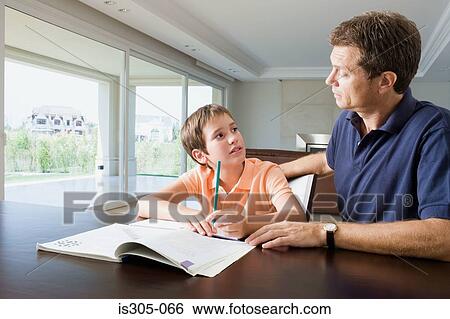 Father helping son with homework View Large Photo Image Stock Photograph - Father helping son with homework. Fotosearch