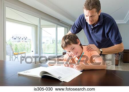 Father watching son do homework View Large Photo Image Stock Image - Father watching son do homework. Fotosearch