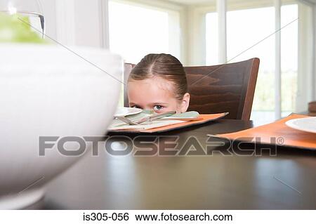 Girl at dinner table View Large Photo Image Stock Photograph - Girl at dinner table. Fotosearch
