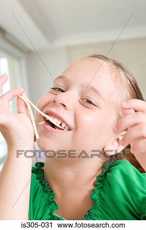 Girl eating spaghetti View Large Photo Image Stock Image - Girl eating spaghetti. Fotosearch
