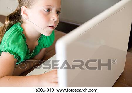 Girl using laptop computer View Large Photo Image Stock Photo - Girl using laptop computer. Fotosearch