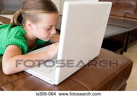 Girl using laptop View Large Photo Image Picture - Girl using laptop. Fotosearch