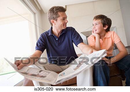 Son and father with newspaper View Large Photo Image Stock Image - Son and father with newspaper. Fotosearch