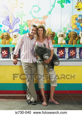 Couple by fairground stall View Large Photo Image Stock Image - Couple by fairground stall. Fotosearch