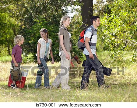 Stock Image - Family going camping. Fotosearch
