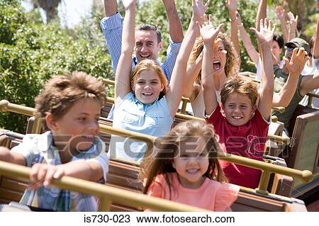 Stock Image - Family on a rollercoaster. Fotosearch