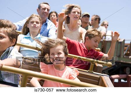 Stock Photo - Family riding a rollercoaster. Fotosearch