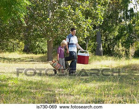 Father and son walking View Large Photo Image Stock Photo - Father and son walking. Fotosearch