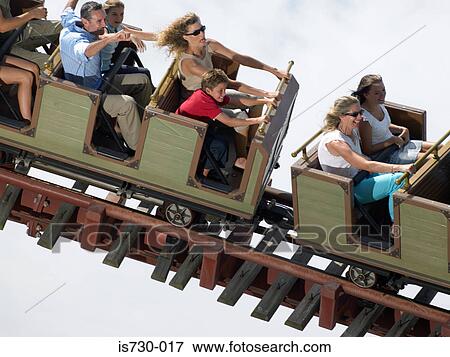 Stock Photo - People on a roller coaster. Fotosearch