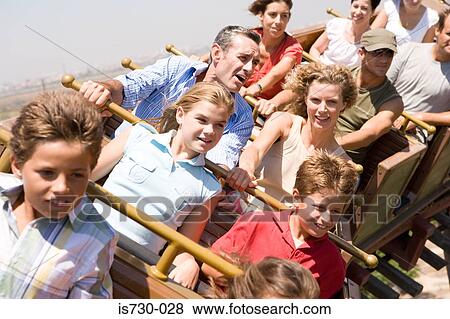 People riding a rollercoaster View Large Photo Image Stock Photo - People riding a rollercoaster. Fotosearch