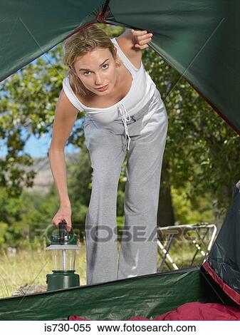 Woman looking into tent View Large Photo Image Stock Photography - Woman looking into tent. Fotosearch