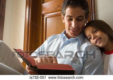 Father reading bible with daughter View Large Photo Image Stock Image - Father reading bible with daughter. Fotosearch