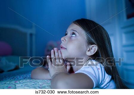 Girl saying bedtime prayers View Large Photo Image Stock Image - Girl saying bedtime prayers. Fotosearch