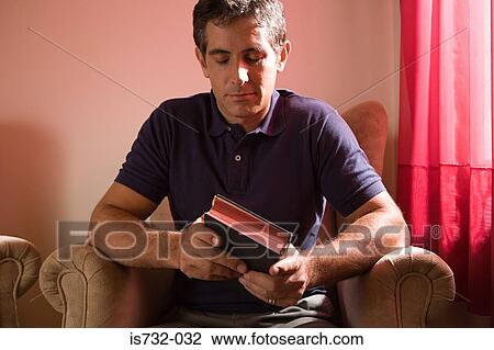 Man holding the bible View Large Photo Image Stock Image - Man holding the bible. Fotosearch