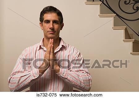 Stock Photography - Man praying. Fotosearch