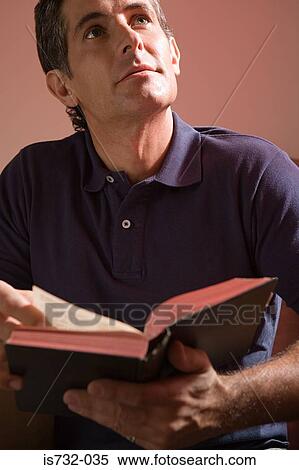 Man reading the bible View Large Photo Image Stock Photography - Man reading the bible. Fotosearch