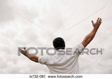 Man worshipping with open arms View Large Photo Image Stock Image - Man worshipping with open arms. Fotosearch