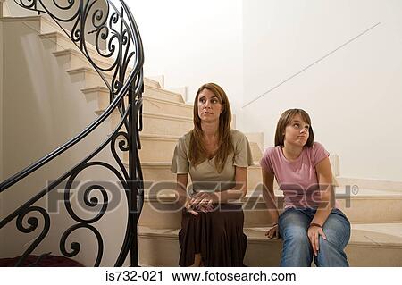 Stock Image - Mother and daughter on stairs. Fotosearch