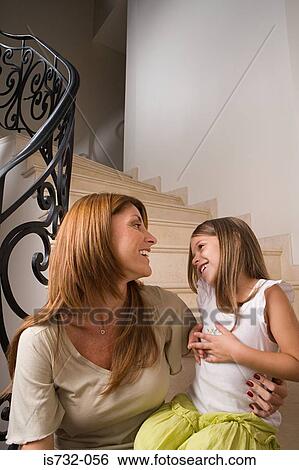 Mother and daughter on stairway View Large Photo Image Stock Photograph - Mother and daughter on stairway. Fotosearch