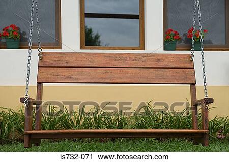 Swing seat in a garden View Large Photo Image Stock Image - Swing seat in a garden. Fotosearch
