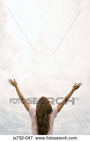Woman worshipping with arms open View Large Photo Image Stock Photo - Woman worshipping with arms open. Fotosearch