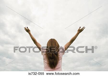 Woman worshipping with open arms View Large Photo Image Stock Photography - Woman worshipping with open arms. Fotosearch