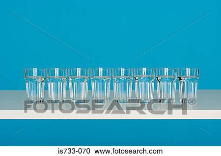 Eight glasses of water View Large Photo Image Stock Image - Eight glasses of water. Fotosearch