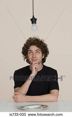 Young man with a plate of raw fish View Large Photo Image Stock Image - Young man with a plate of raw fish. Fotosearch