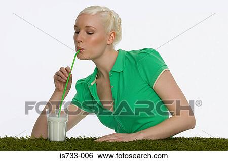 Young woman drinking milk View Large Photo Image Stock Photograph - Young woman drinking milk. Fotosearch