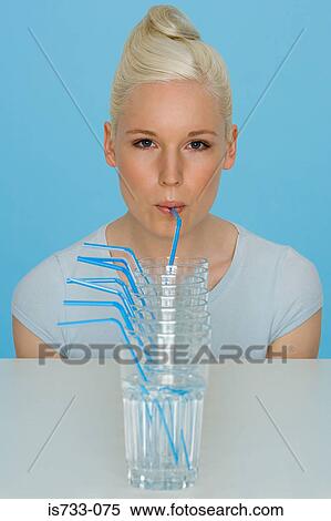 Young woman drinking water View Large Photo Image Stock Photography - Young woman drinking water. Fotosearch