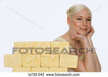 Young woman with blocks of butter View Large Photo Image Stock Image - Young woman with blocks of butter. Fotosearch