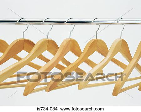 Coathangers on a clothes rail View Large Photo Image Picture - Coathangers on a clothes rail. Fotosearch