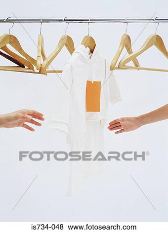 People reaching for the same top View Large Photo Image Stock Photo - People reaching for the same top. Fotosearch
