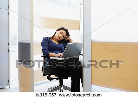 Stock Photo - Bored looking office worker. Fotosearch