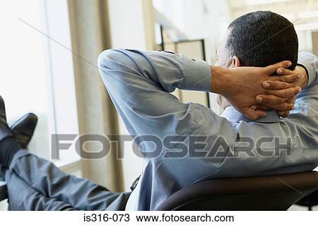 Businessman relaxing View Large Photo Image Stock Image - Businessman relaxing. Fotosearch
