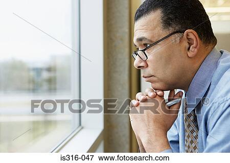 Serious looking businessman View Large Photo Image Stock Photo - Serious looking businessman. Fotosearch