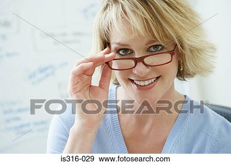 Stock Photo - Smiling woman wearing eyeglasses. Fotosearch