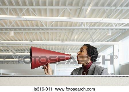 Woman shouting into a megaphone View Large Photo Image Stock Image - Woman shouting into a megaphone. Fotosearch